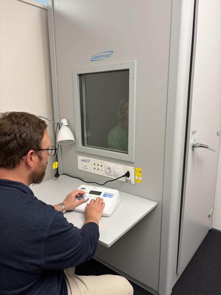 Occupational Health Specialist conducting a hearing test
