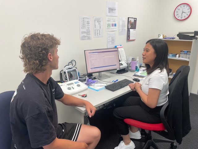 Occupational health specialist speaking to a client.