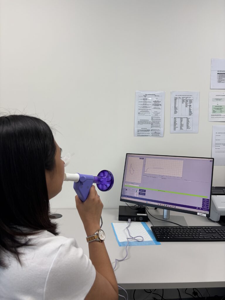 Lady receiving a workplace lung function test